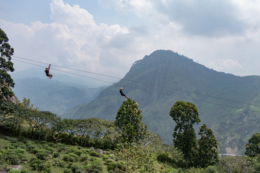 Ella, Sri Lanka March 22, 2022 People riding the Flying Ravana Mega Zipline over the green hills.