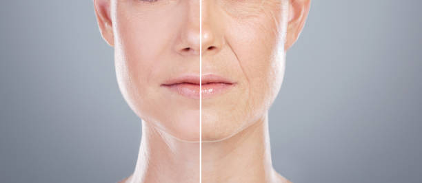 studio shot of an unrecognisable woman's face split into two sides against a grey background - wrinkled skin imagens e fotografias de stock