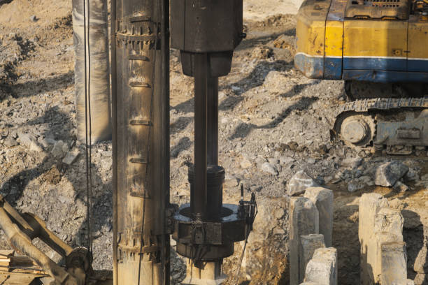 istock The pile driver hammers the pile. 1397290351