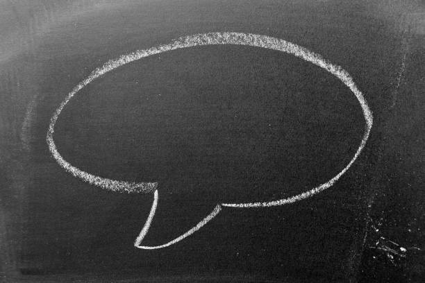 istock White color chalk hand drawing in round bubble speech shape with blank space on blackboard or chalkboard background 1397295572
