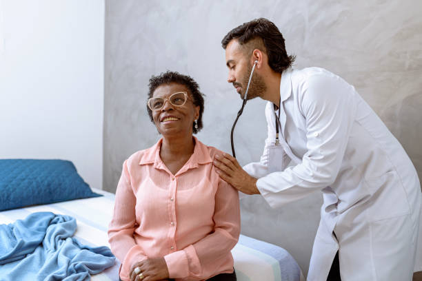 istock Nurse checking old lady's breathing at her residence.. 1397301630