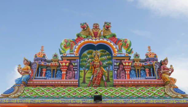 istock Indian traditional Goddess Mariyamman statue on temple tower 1397303132