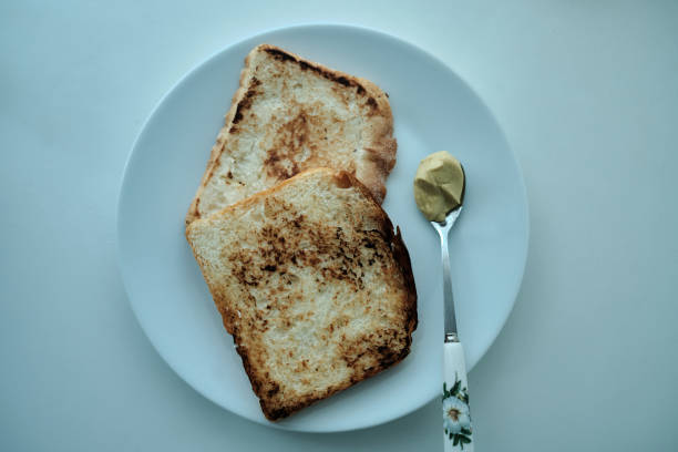 peanut butter and toast on dining table, directly above