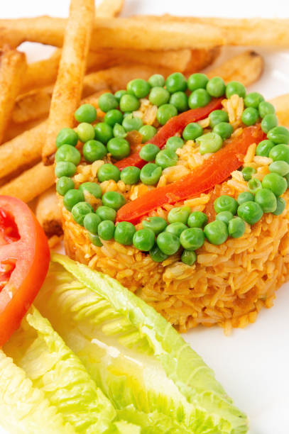 Colombian-Style arroz con pollo on white background. Rice with chicken is one of the most popular dishes in Colombia and South America.