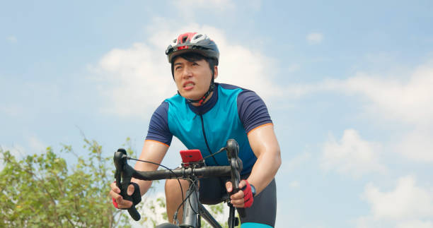 istock Asian young man riding bicycle 1397304937