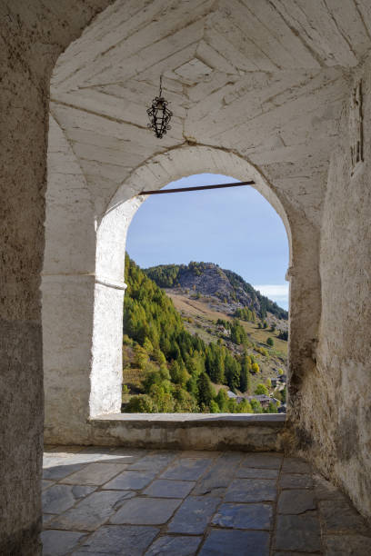 istock Ancient arcades passageway, St Magnus sanctuary, Castelmagno, Italy 1397305891