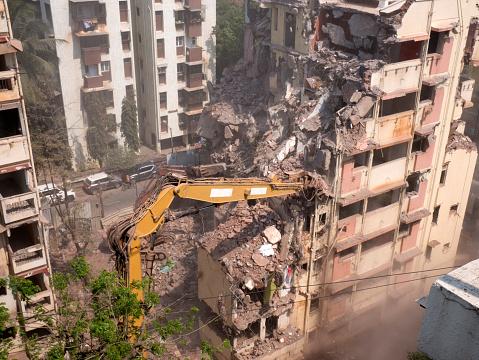 Building demolition machines working at Bandra Mumbai state Maharashtra India