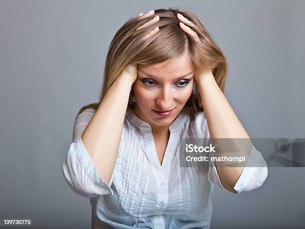 Woman In Depression On Gray Background Stock Photo - Download Image Now - Adult, Anxiety, Blond Hair