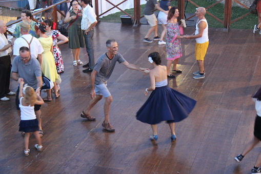 Senigallia, Italy - August 11, 2019 The Summer Jamboree is an international music festival focusing on 1950s American music and culture here by wild dancers.\nIn the photo: people dressed in 50's style