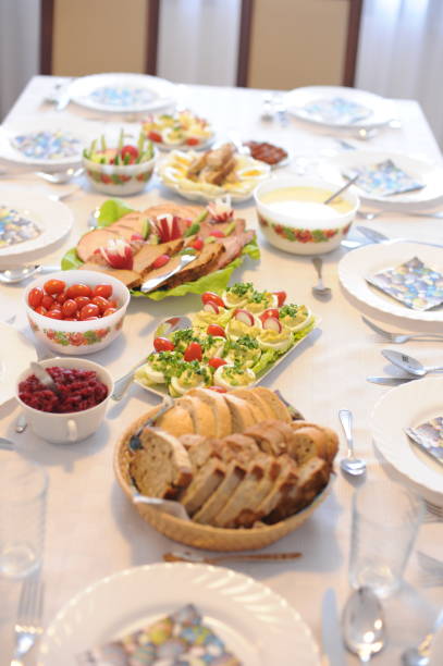 istock Festive table setting with elegant cutlery and crockery and hand-painted plates with meat plate, eggs and bread for Easter dining in Poland 1397313741