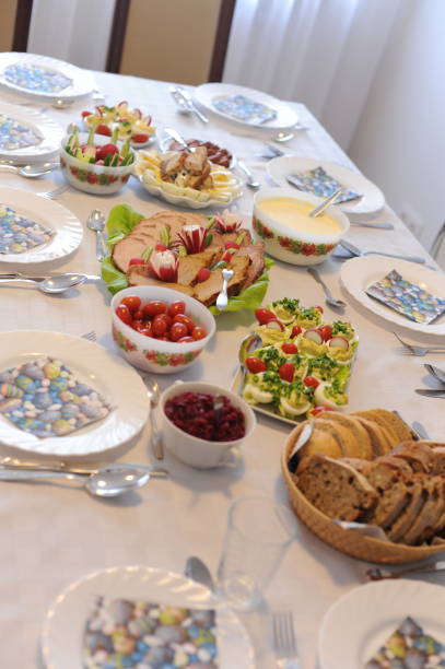 istock Festive table setting with elegant cutlery and crockery and hand-painted plates with meat plate, eggs and bread for Easter dining in Poland 1397313743