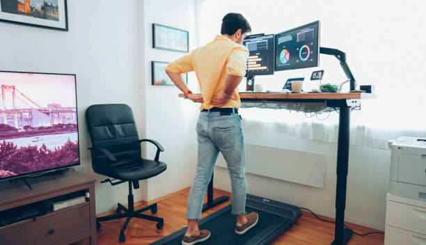 istock Standing desk home office with under desk treadmill 1397316755