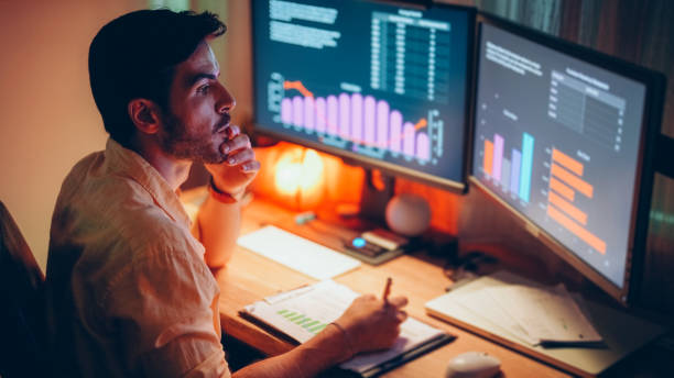 istock Businessman at home working late 1397316774