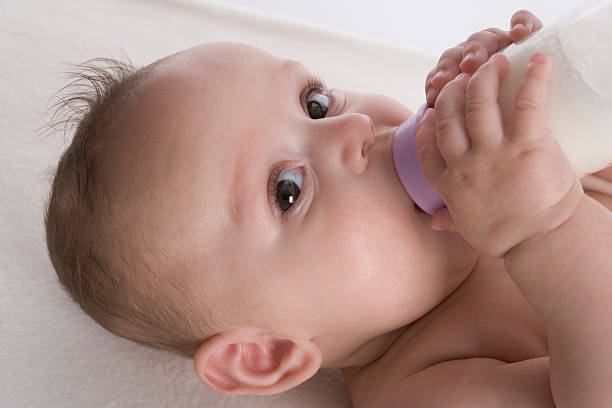 istock Baby drinking milk from a bottle 139731871