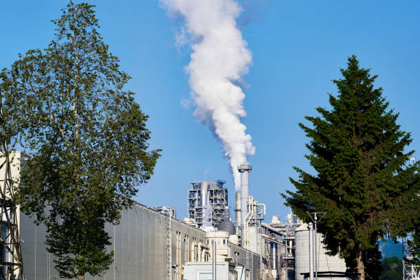 Chimney billowing dirty smoke into the atmosphere, causing air pollution and contributing to the risk of climate change.
