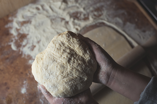 flour dough in hands