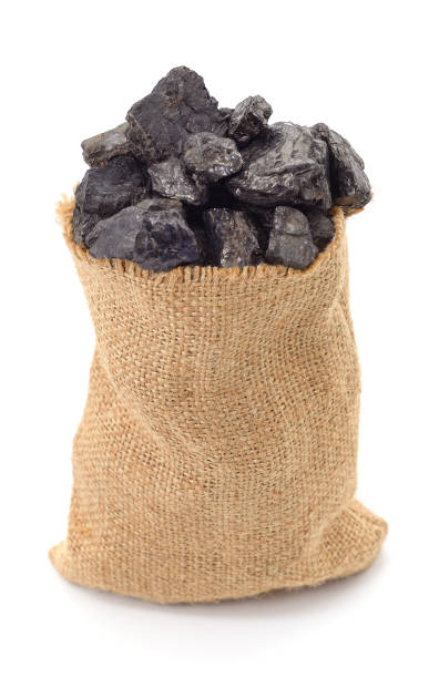 Coal in a bag. Coal in a bag isolated on a white background. hard bituminous coal stock pictures, royalty-free photos & images