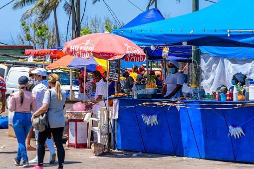 Havana, Cuba - April 28, 2022: Cuban people walking in the gastronomic area of the 'Feria del Libro'. The annual event promotes reading while marketing the most recent written content by national and international authors.