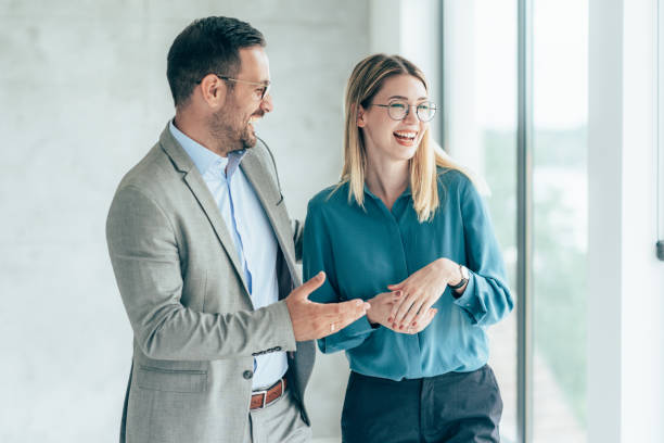 istock Two cheerful business people 1397326824