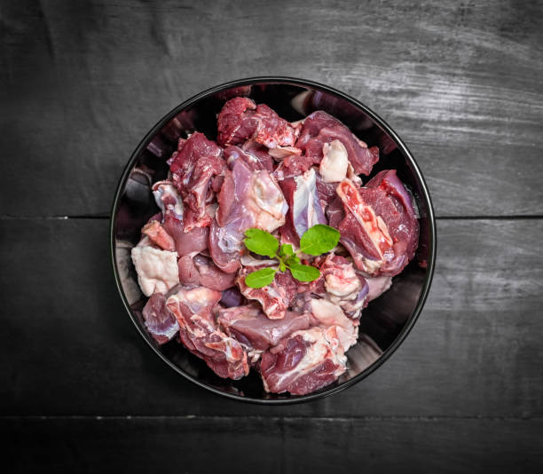 Chopped raw meat on black background , top view . raw Lamb and mutton meat isolated.