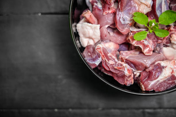 istock Chopped raw meat on black background , top view . raw Lamb and mutton meat isolated. 1397328196