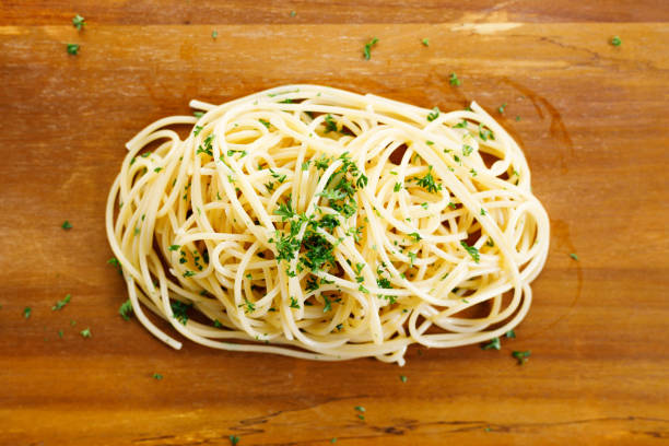 istock cooked spaghetti pasta on wooden plate. 1397328337