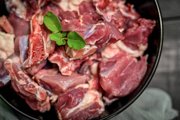 istock Chopped raw meat on black background , top view . raw Lamb and mutton meat isolated. 1397328357