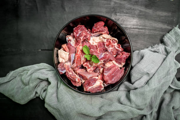 istock Chopped raw meat on black background , top view . raw Lamb and mutton meat isolated. 1397328390