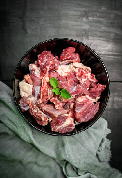 istock Chopped raw meat on black background , top view . raw Lamb and mutton meat isolated. 1397328391