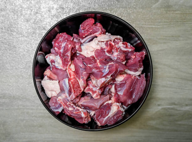 istock Chopped raw meat on black background , top view . raw Lamb and mutton meat isolated. 1397328412