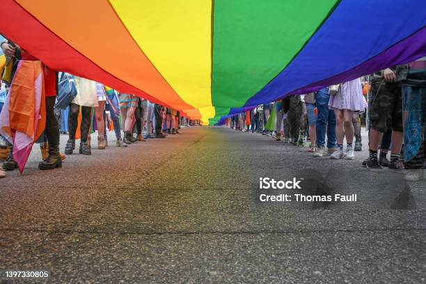 Under A Lgbt Pride Flag Stock Photo - Download Image Now - Protest, LGBTQIA Culture, LGBTQIA Rights