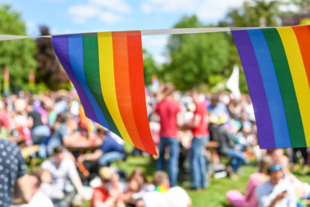 istock LGBT Pride Flags with people in the background 1397330842