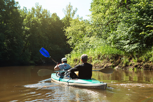 Symonds, Yat, England - September 2020:  Two people in a canoe on the River Wye in Symonds Yat.