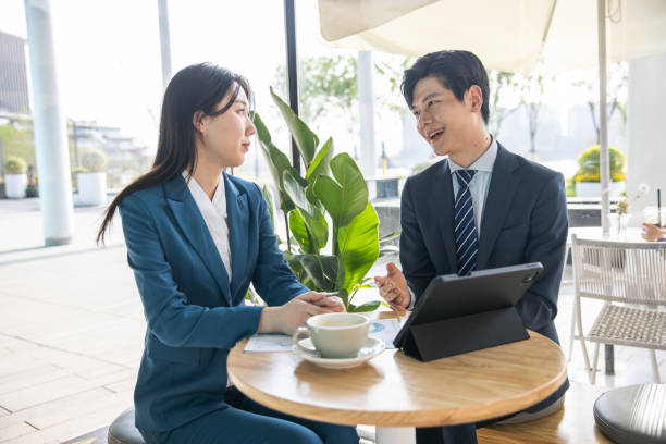 istock Business partners having a meeting in a cafe 1397331890
