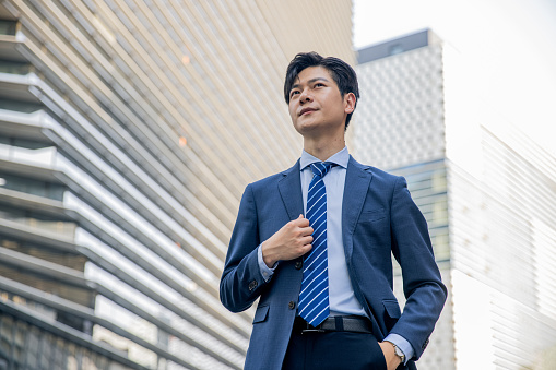 Young asian businessman portrait in the city