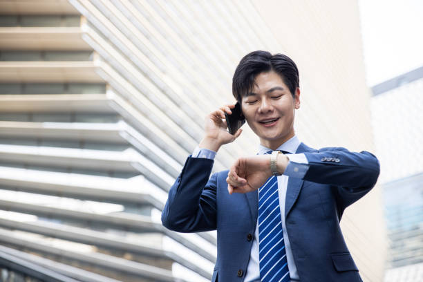 istock Businessman checking the time outdoor 1397332050