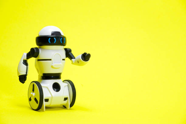 Robot on a yellow background with a place for text for a toy store and children's technology centers