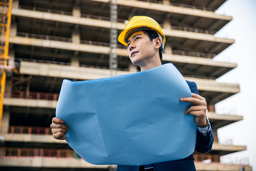 Engineer supervising building process in a building sites
