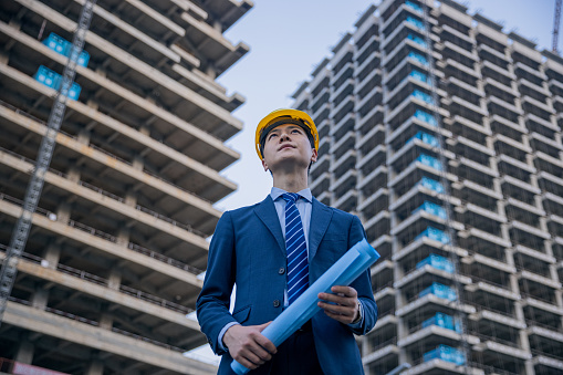 Engineer looking new skyscraper buildings