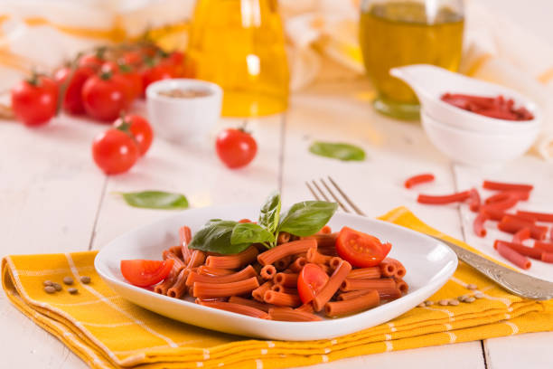 Lentil pasta with cherry tomatoes and basil.