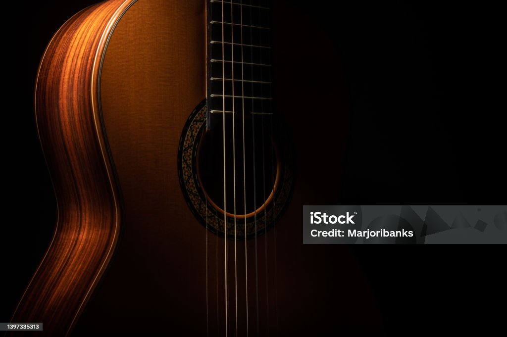 Classical guitar Classical guitar on a black background with copy space Guitar Stock Photo