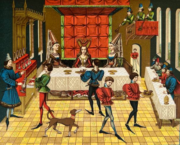 Medieval banquet in a castle, color illustration Illustration from 19th century. medieval stock illustrations