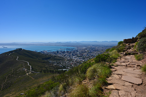 A view of the city of Cape Town as tourists are seen hiking up Lions Head mountain in South Africa. More than two years after the pandemic and strict lockdown which saw travel bans placed on South Africa, international travel has seen a recovery of 76% in Cape Town and domestic by 75% with 27 000 passengers pass through airports last weekend .
