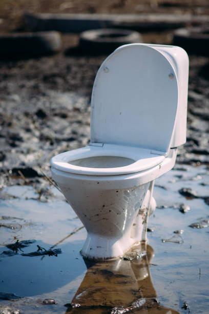 close up dirty flush toilet Standing in a puddle stock photo