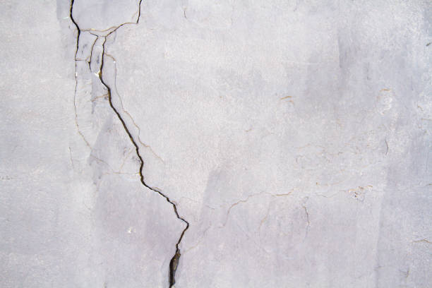 istock Texture of an old stone with a crack. Grunge brick texture. 1397338652
