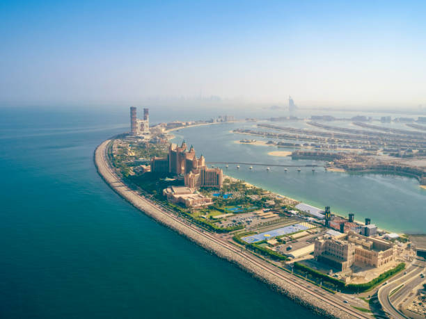Aerial view of artificial palm island in Dubai The Palm Jumeirah in Dubai, Dubai, United Arab Emirates dubai island stock pictures, royalty-free photos & images