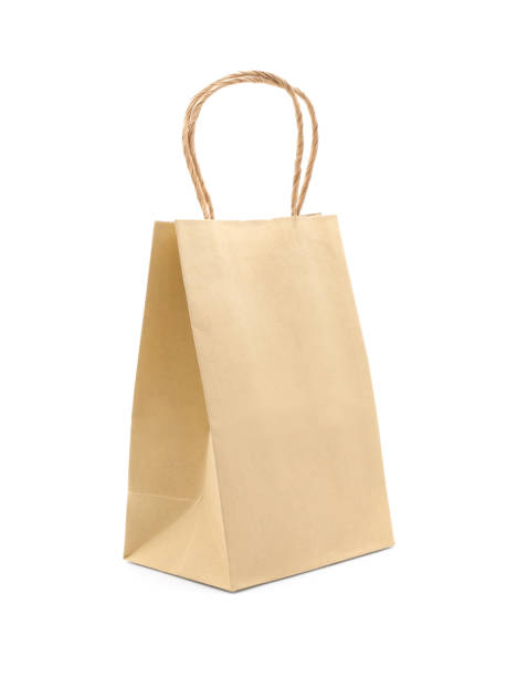 istock Recycled kraft paper shopping bag isolated on white background. 1397339955