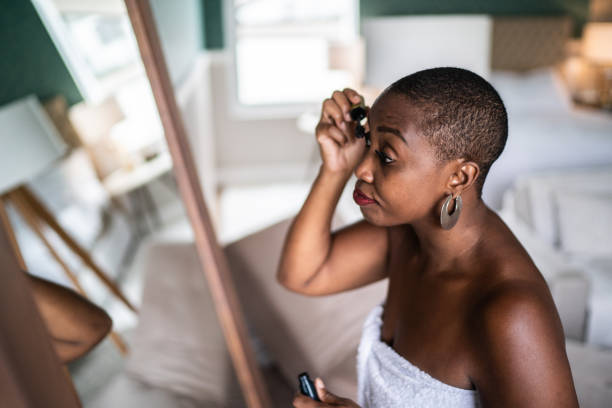 istock Woman wearing a towel applying mascara 1397340989
