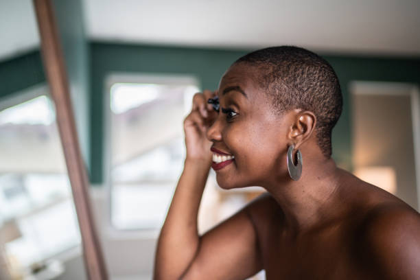 istock Woman wearing a towel applying mascara 1397341003