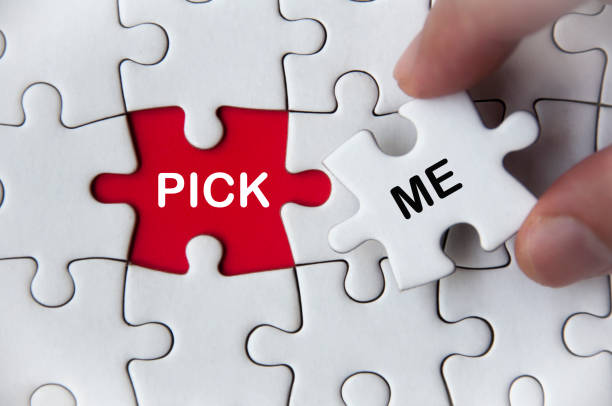 istock Pick me text on missing jigsaw puzzle. Employment and hiring concept 1397341053